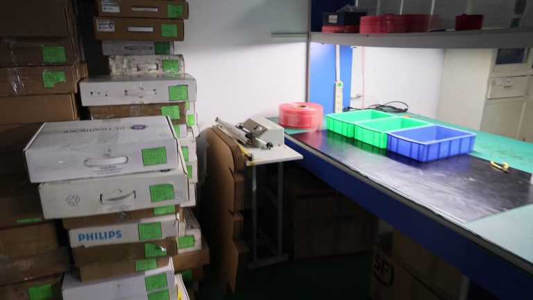 Packing area with original GE Healthcare and Philips probe cases ready for return shipping