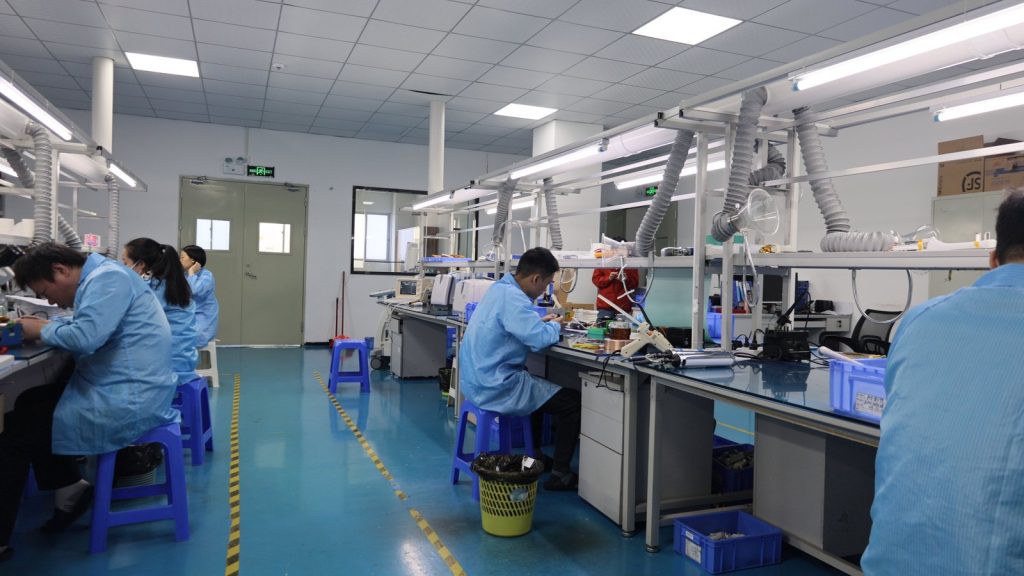How to Repair the Ultrasound Probe? 1 Technicians working on ultrasound probes at separate repair benches