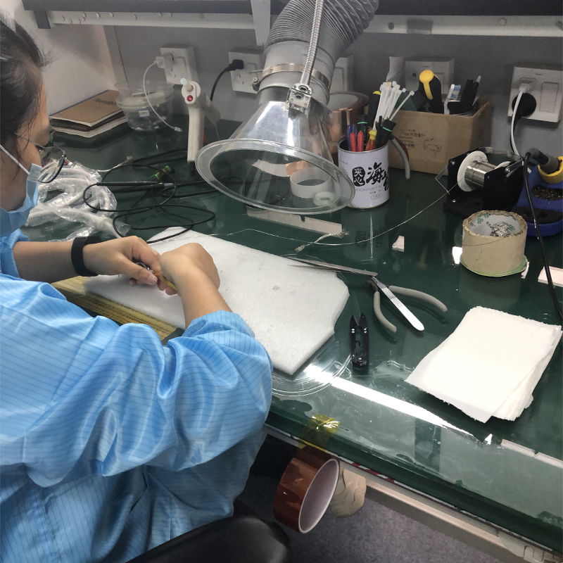 Ultrasound Probe Repair 2 Ultrasound Probe Supplier Close-up ultrasound probe repair work at an anti-static workbench with magnification